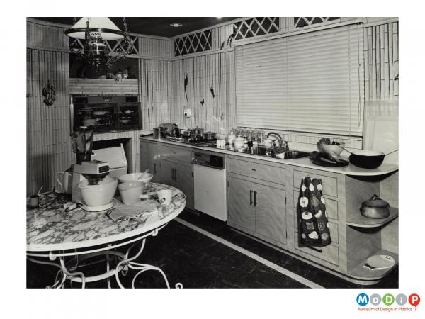 Scanned image showing a fitted kitchen.