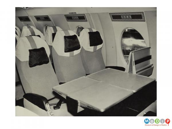 Scanned image showing the interior of an aeroplane.