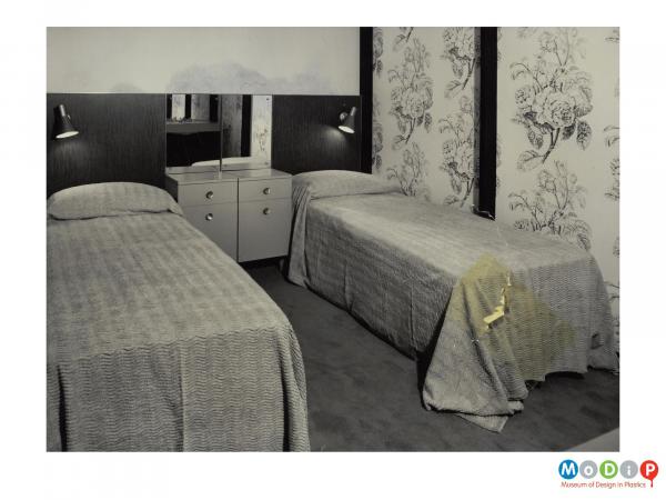 Scanned image showing a bedroom with twin beds.