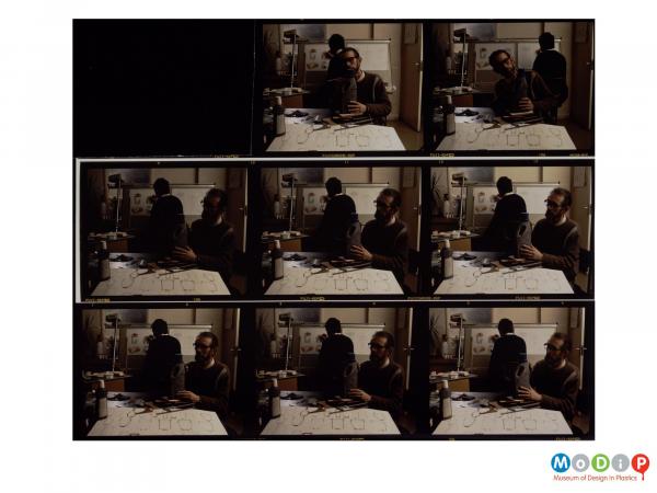 Scanned image showing a contact sheet of 8 images of a male worker sculpting a bottle from drawn designs.