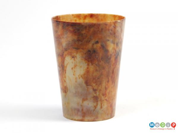 Side view of a beaker showing the marbled material.