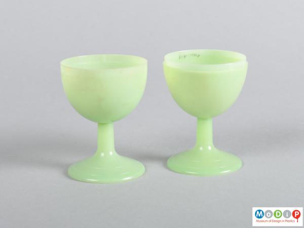 Side view of a pair of egg cups showing the goblet shape.