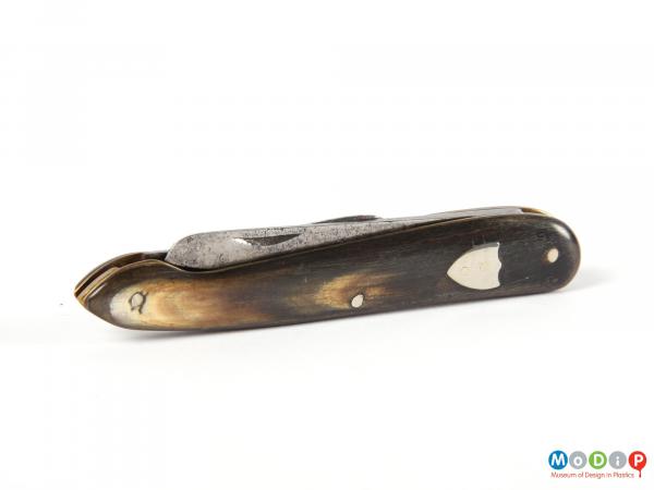 Side view of a penknife showing the silver mounts.