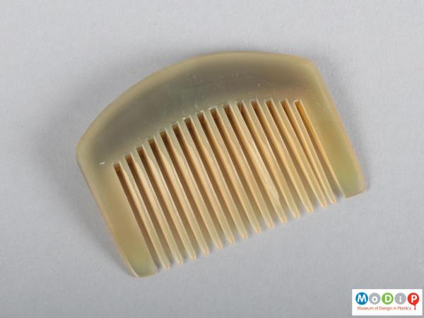 Top view of a comb showing the heading and teeth.