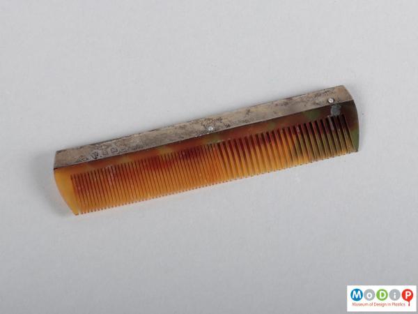 Top view of a comb showing the heading and teeth.