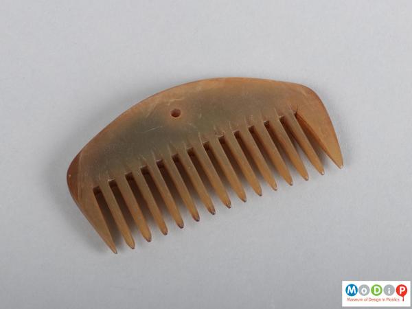 Top view of a comb showing the heading and teeth.