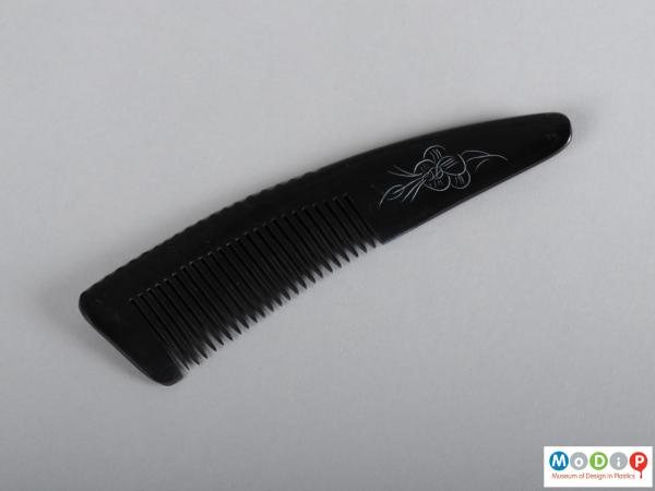 Top view of a comb showing the heading and teeth.