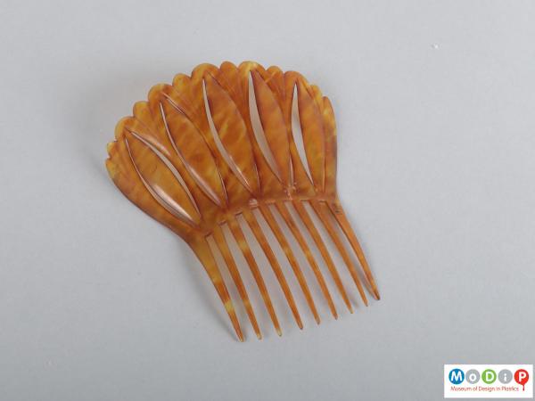 Top view of a comb showing the heading and teeth.