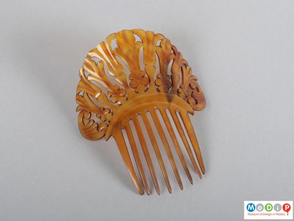 Top view of a comb showing the heading and teeth.