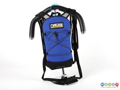 Front view of a Camelbak showing the bag hanging on a shoulder form.