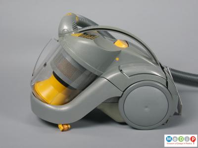 Side view of a vacuum cleaner showing the clear bin.