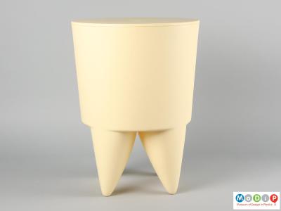 Side view of a BuBu 1er stool showing the straight-sided top section and the curved legs below.