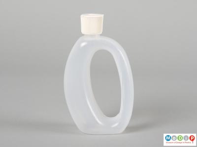 Side view of Runaid bottle showing the whole in the centre forming a handle.