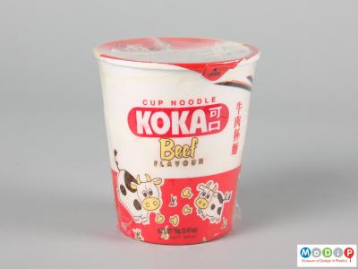 Side view of a Kako Beef noodles pot showing the printed illustration.