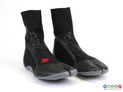 Front view of a pair of surfing boots showing the split toes.