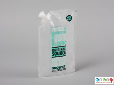 Front view of a shower gel packet showing the spout.
