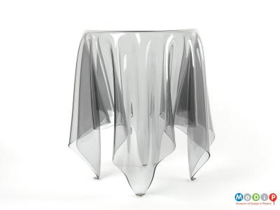 Side view of an Illusion table showing the drape of the material and the legs.