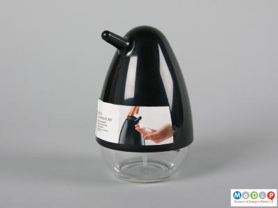 Side view of a soap dispenser showing the beak shaped spout.