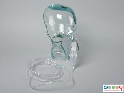 Side view of a nebuliser mask showing it with the chamber and tubing.