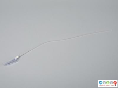Side view of a catheter suction mully showing tube and tip.