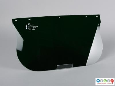 Front view of a safety visor showing the scored corners.