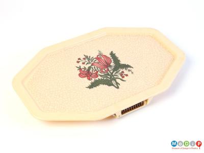 Top view of a chair tray showing the crackle pattern and floral decoration.