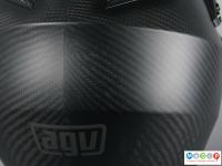 A close view of carbon fibre weave used in a motocross helmet. 